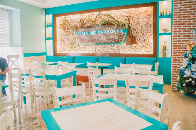 Interior view of Dave's hot chicken open kitchen preparing orders
